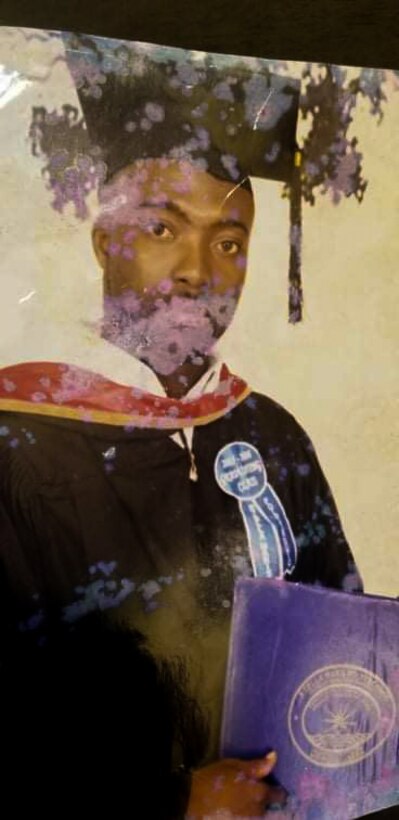 Ajay Vogar poses for his college graduation photo.