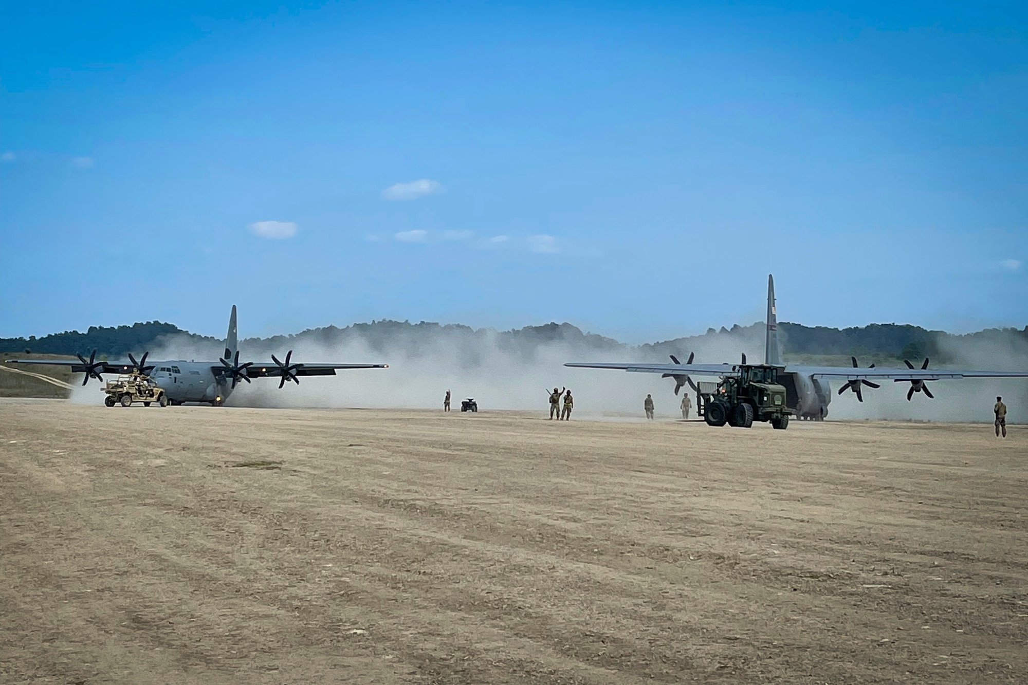 Airmen from the 103rd Logistics Readiness Squadron load cargo onto C-130J Super Hercules aircraft during Exercise Sentry Storm at Camp Branch, West Virginia, July 22, 2021. Sentry Storm is a joint training environment enabling participants to exercise their skills to prevail over near-peer competitors while applying Agile Combat Employment concepts. (Courtesy photo)