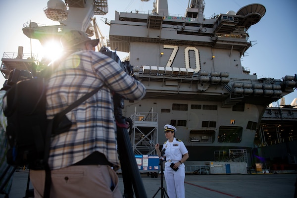 Lt. Cmdr. Miranda Williams, public affairs officer of the Nimitz-class aircraft carrier USS Carl Vinson (CVN 70) and Carrier Strike Group (CSG) 1, speaks with local media.