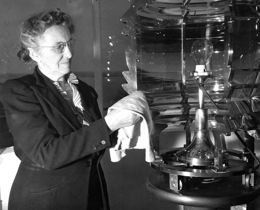 Lightkeeper Fannie Mae Salter cleans the lens of the Turkey Point Light