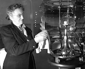 Lightkeeper Fannie Mae Salter cleans the lens of the Turkey Point Light