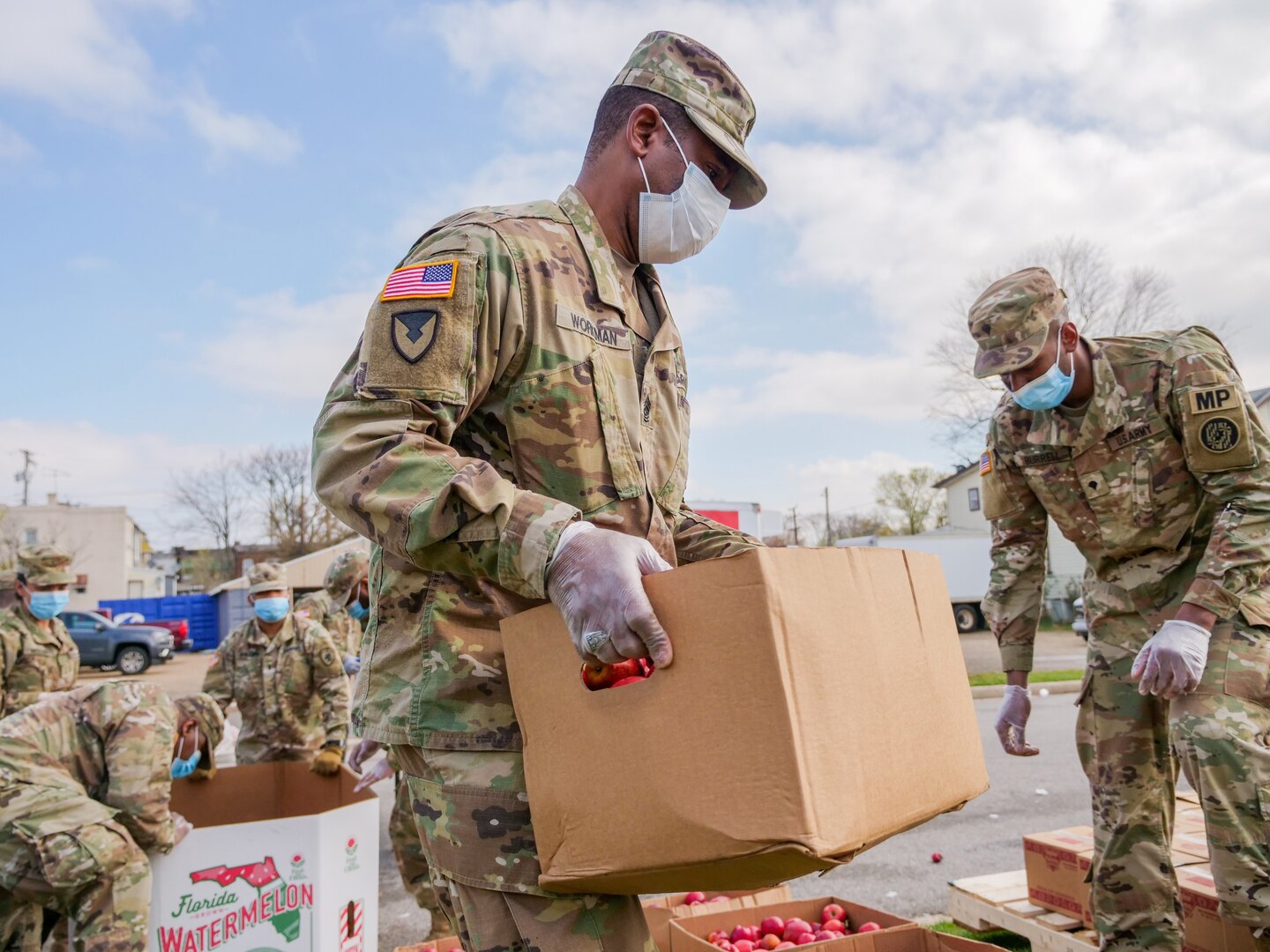 Maryland Army National Guard Soldiers help distribute food to members of the Baltimore community March 26, 2020.