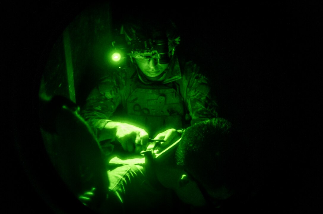 Airman 1st Class Jakobo Vasquez Cuartas, 20th Civil Engineer Squadron explosive ordnance disposal technician, removes a training neck bomb during field training exercise Operation Guillotine at Seymour Johnson Air Force Base, North Carolina, July 29, 2021.