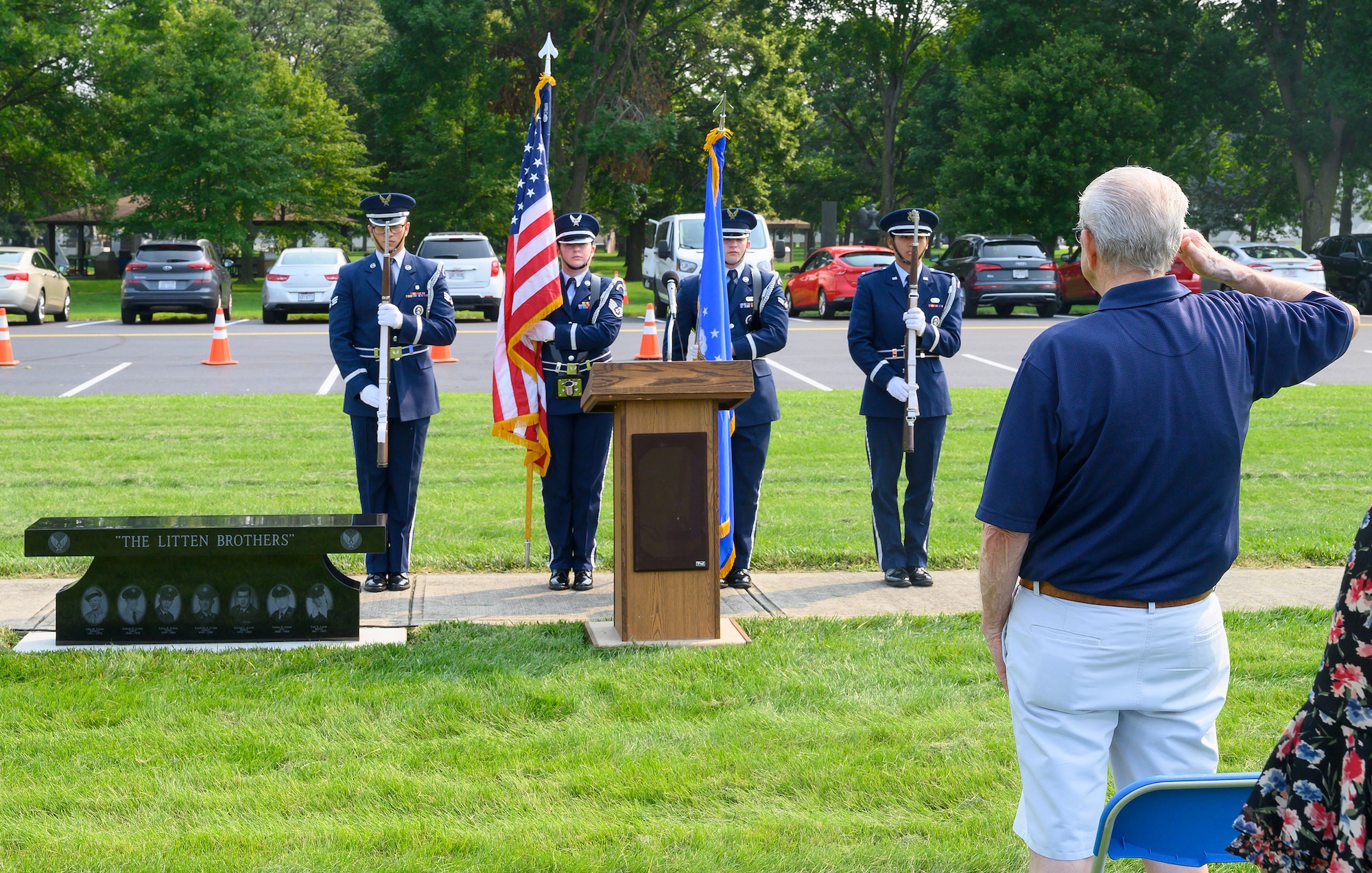Jerry Litten salutes the flag at the end of a ceremony dedicating a memorial bench at the National Museum of the Air Force, Wright-Patterson Air Force Base, Ohio, honoring him and his brothers. The seven Litten brothers served a combined total of 137 years in the U.S. Air Force. (U.S. Air Force photo by R.J. Oriez)