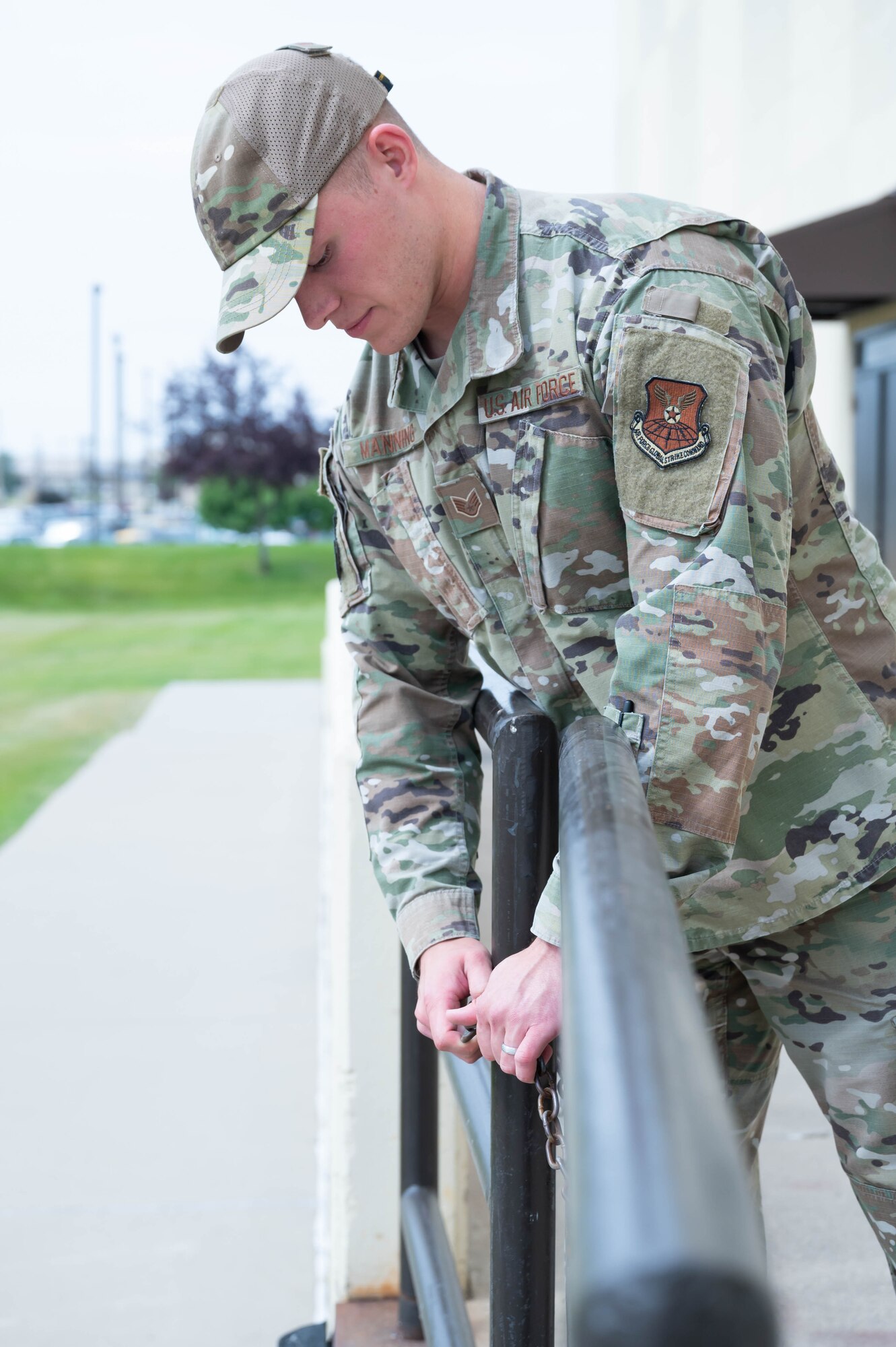 Staff Sgt. Justin Manning, 341st Missile Wing occupational safety technician, secures a loading dock gate with a chain Aug. 2, 2021, at Malmstrom Air Force Base, Mont.