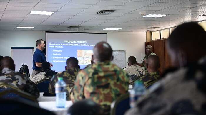 (Aug. 2, 2021) Hospital Corpsman 1st Class Marcelin Aggossou, right, translates during a training evolution as part of Cutlass Express 2021 in East Africa, Aug. 2, 2021. Cutlass Express is designed to improve regional cooperation, maritime domain awareness and information sharing practices to increase capabilities between the U.S., East African and Western Indian Ocean nations to counter illicit maritime activity.