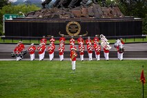 Marines with “The Commandant’s Own,” U.S. Marine Drum and Bugle Corps, perform during the Tuesday Sunset Parade at the Marine Corps War Memorial, Arlington, Va., Aug. 3, 2021.