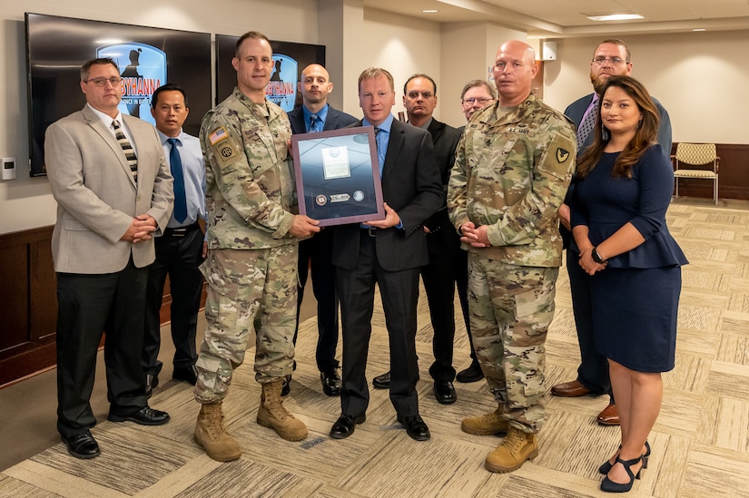 Photo of employees accepting the award