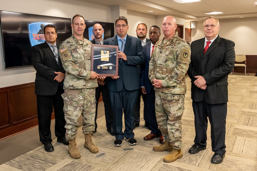 Photo of employees accepting the award