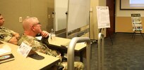 U.S. Army Reserve Brig. Gen. Jeffrey C. Coggin, commanding general of the U.S. Army Civil Affairs and Psychological Operations Command (Airborne), participates in the Joint Warfighting Assessment 2021 distinguished visitor day initial briefing at Fort Carson, Colo., June 25, 2021. USACAPOC(A) Civil Affairs, Psychological Operations, and Information Operations Soldiers took part in JWA 2021 with participants from different Army units and multinational partners such as U.K., Australian and Canadian armed forces, working to improve interoperability between U.S. joint forces and our allies. JWA exercises help the Army evaluate emerging concepts, integrate new technologies, and promote interoperability between the Army, other services, and our multinational partners. Joint and multinational partners are key to the success of Multi-Domain Operations.