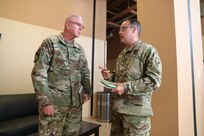 U.S. Army Reserve Brig. Gen. Jeffrey C. Coggin, commanding general of the U.S. Army Civil Affairs and Psychological Operations Command (Airborne), receives a back brief from Lt. Col. Daniel C. Schmidt, G35 operations chief for USACAPOC(A), while participating in the Joint Warfighting Assessment 2021 distinguished visitor day initial briefing at Fort Carson, Colo., June 25, 2021. USACAPOC(A) Civil Affairs, Psychological Operations, and Information Operations Soldiers took part in JWA 2021 with participants from different Army units and multinational partners such as U.K., Australian and Canadian armed forces, working to improve interoperability between U.S. joint forces and our allies. JWA exercises help the Army evaluate emerging concepts, integrate new technologies, and promote interoperability between the Army, other services, and our multinational partners. Joint and multinational partners are key to the success of Multi-Domain Operations.