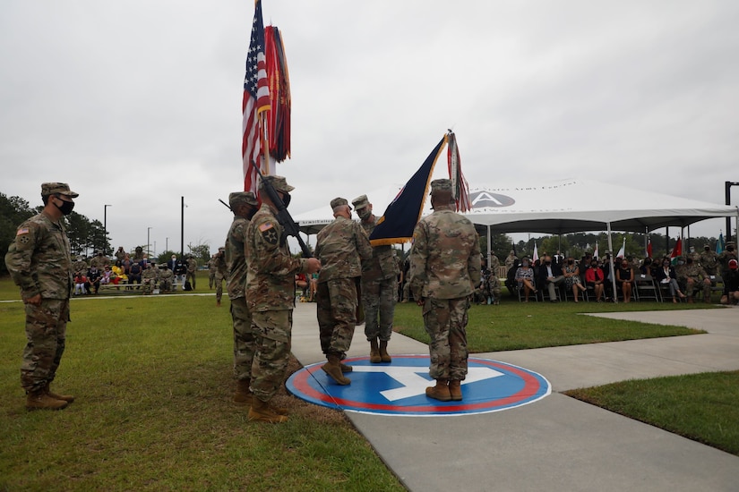 U.S. Army Central Senior Enlisted Advisor, Command Sgt. Maj. Brian Hester, passes the unit colors to outgoing Commanding General, Lt. Gen. Terry Ferrell, during the Army Service Component Command's Change of Command ceremony at Patton Hall's Lucky Park on Shaw Air Force Base, S.C., Aug. 4, 2021. Ferrell took command of USARCENT on March 8, 2019, and officially relinquished command to Lt. Gen. Ronald P. Clark during the ceremony. (U.S. Army photo by Spc. Amber Cobena)