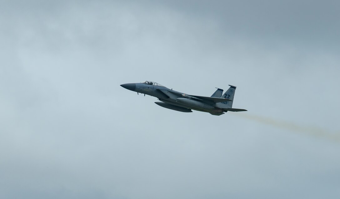 A F-15C flies over Kadena Air Base