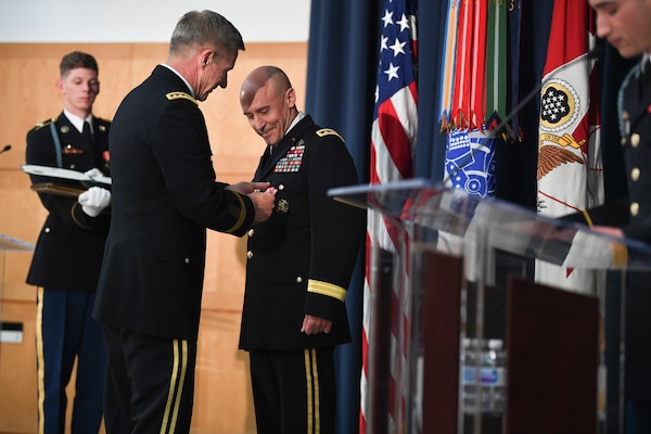 U.S. Army Gen. James C. McConville presents the Distinguished Service Medal to U.S. Army Lt. Gen. Thomas A. Horlander during a retirement ceremony at Lincoln Hall, Ft. McNair in Washington, D.C., June 23, 2021.  (U.S. Army photo by Joseph B. Lawson)