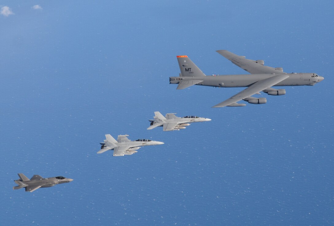 Royal Australian Air Force aircraft No.6 Squadron (SQN) EA-18G Growler, a No.1 SQN F/A-18F Super Hornet and from No.3 SQN, a F-35A Lightning aircraft, fly alongside a United States Air Force B-52 Stratofortress aircraft from the 69th Expeditionary Bomb Squadron based at Guam, during Exercise Talisman Sabre 2021. (Photo credit: SGT Andrew Eddie)
