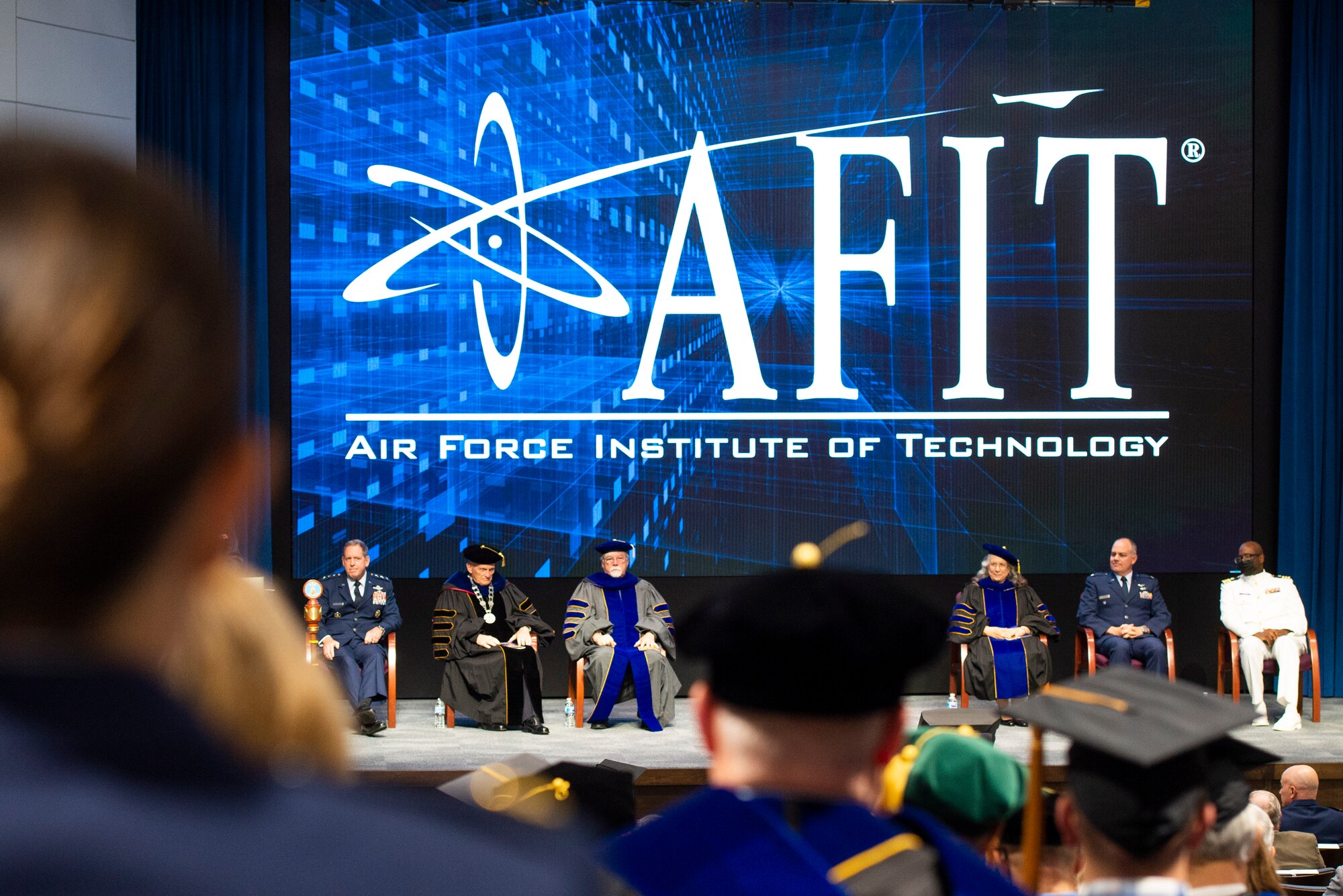 The Air Force Institute of Technology conducts an acceptance-of-leadership ceremony July 27 for Walter Jones, who takes the helm as director and chancellor at the Wright-Patterson Air Force Base campus. Jones is the 50th AFIT leader and only the second civilian. (U.S. Air Force photo by Wesley Farnsworth)