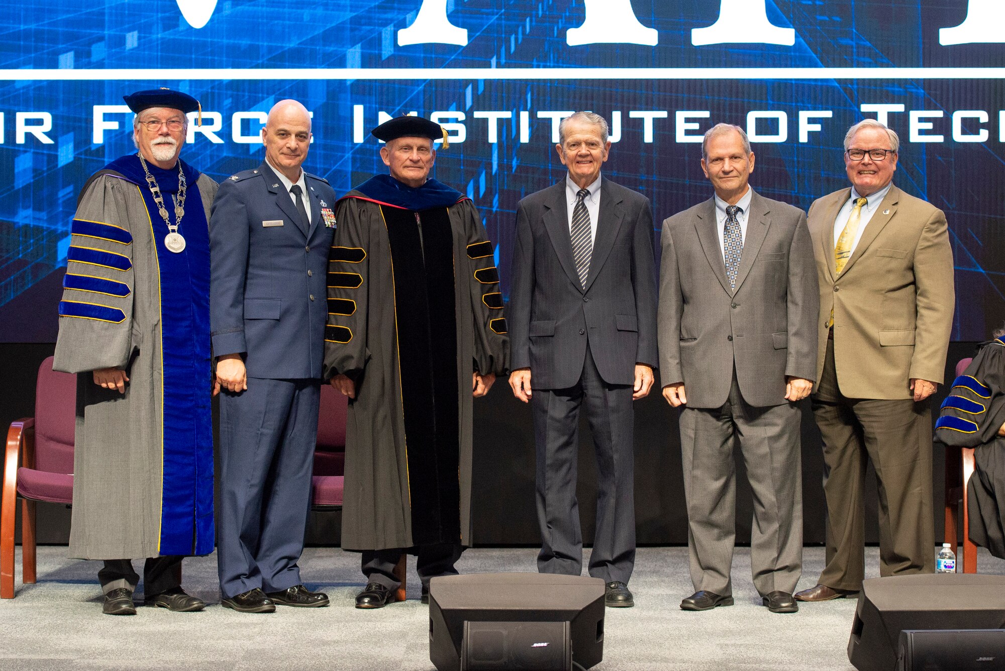 Walter Jones (far left), new Air Force Institute of Technology director and chancellor, poses for a photo with past AFIT leaders during a ceremony July 27 at Wright-Patterson Air Force Base. (U.S. Air Force photo by Wesley Farnsworth)