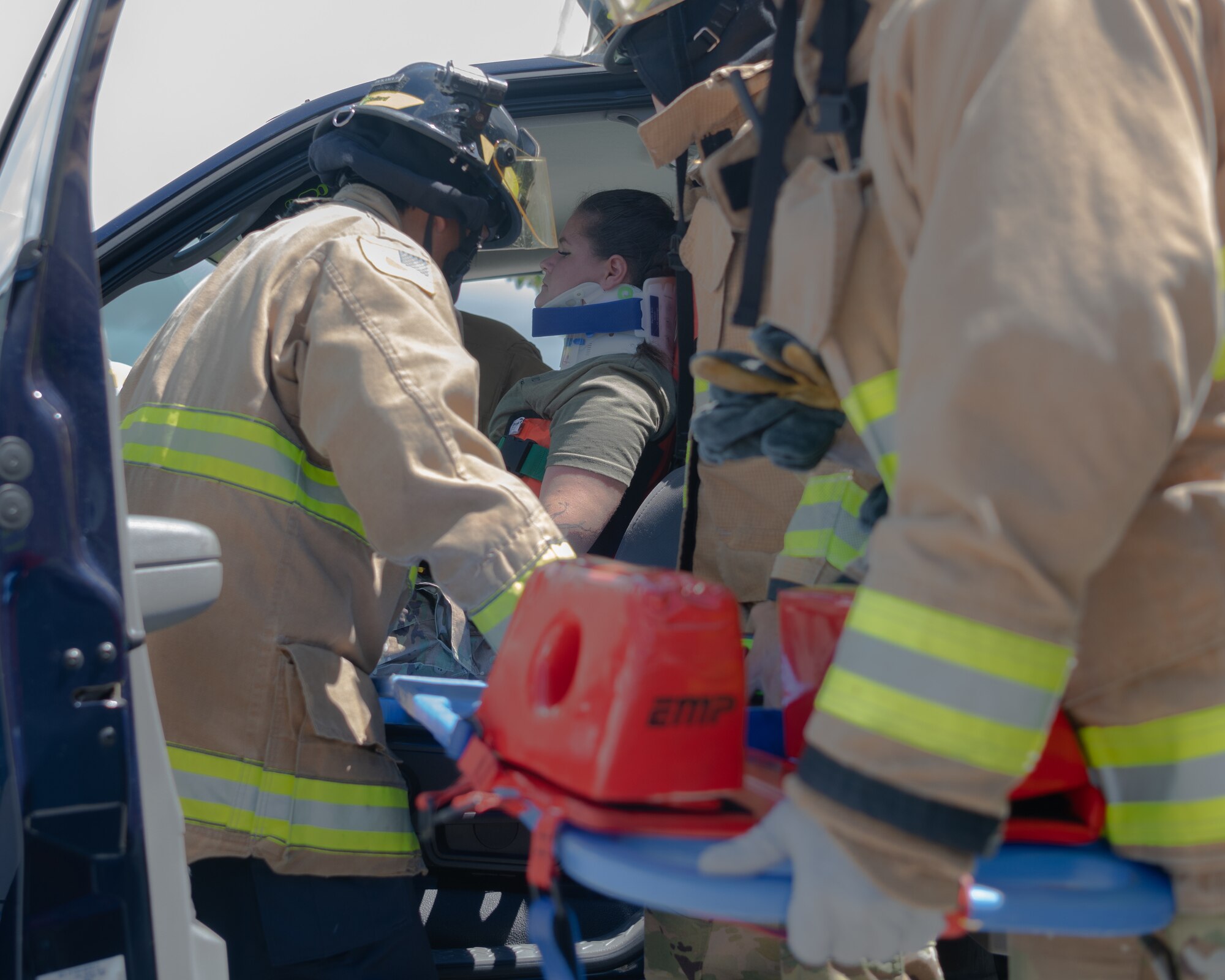Pictures of the 18th CEF conducting vehicle extrication training on a simulated patient.