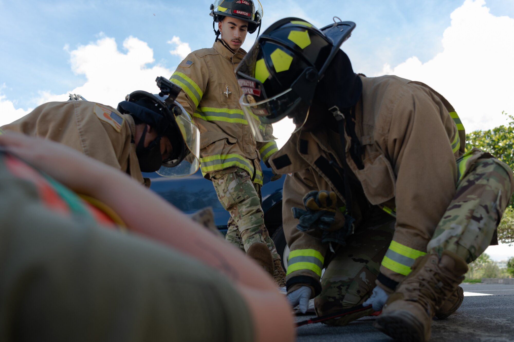 Pictures of the 18th CEF conducting vehicle extrication training on a simulated patient.