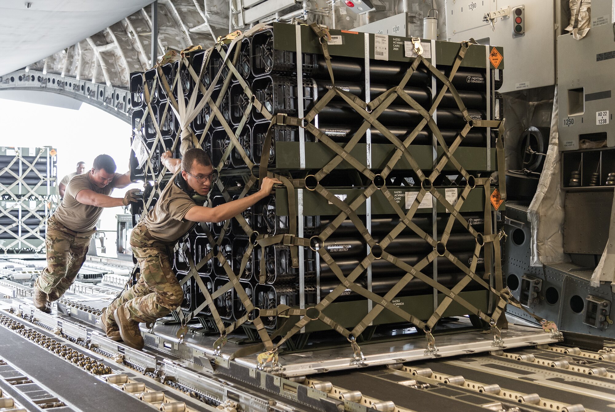 Airmen from the 436th Aerial Port Squadron load pallets onto a C-17 Globemaster III as part of a foreign military sales mission at Dover Air Force Base, Delaware, July 29, 2021. The U.S. and Nigeria have a long-standing partnership.The bilateral relationship is built on several pillars including security cooperation. Nigeria is a key partner in countering violent extremist organizations throughout the Lake Chad Basin. (U.S. Air Force photo by Roland Balik)