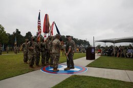 Marine Corps Gen. Kenneth McKenzie, Commander of U.S. Central Command, passes the U.S. Army Central colors to incoming Commanding General, Lt. Gen. Ronald P. Clark, during the Army Service Component Command's Change of Command ceremony at Patton Hall's Lucky Park on Shaw Air Force Base, S.C., Aug. 4, 2021. During the ceremony, Clark assumed command from outgoing Commanding General, Lt. Gen. Terry Ferrell. (U.S. Army photo by Spc. Amber Cobena)