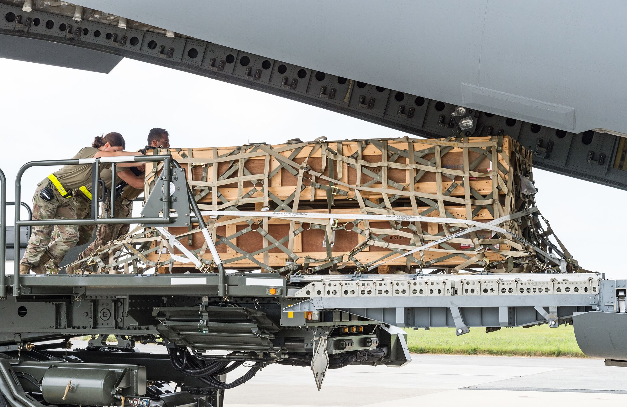 Airmen from the 436th Aerial Port Squadron load pallets onto a C-17 Globemaster III as part of a foreign military sales mission at Dover Air Force Base, Delaware, July 29, 2021. The U.S. and Nigeria have a long-standing partnership.The bilateral relationship is built on several pillars including security cooperation. Nigeria is a key partner in countering violent extremist organizations throughout the Lake Chad Basin. (U.S. Air Force photo by Roland Balik)