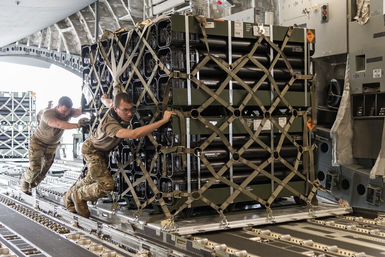 Airmen from the 436th Aerial Port Squadron load pallets onto a C-17 Globemaster III as part of a foreign military sales mission at Dover Air Force Base, Delaware, July 29, 2021. The U.S. and Nigeria have a long-standing partnership.The bilateral relationship is built on several pillars including security cooperation. Nigeria is a key partner in countering violent extremist organizations throughout the Lake Chad Basin. (U.S. Air Force photo by Roland Balik)