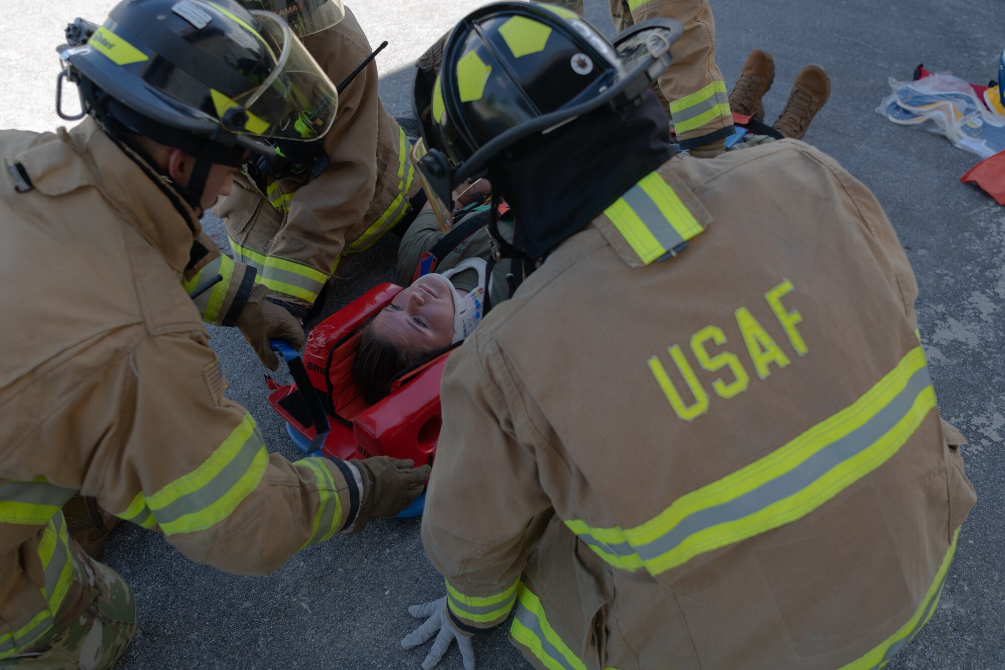 Pictures of the 18th CEF conducting vehicle extrication training on a simulated patient.