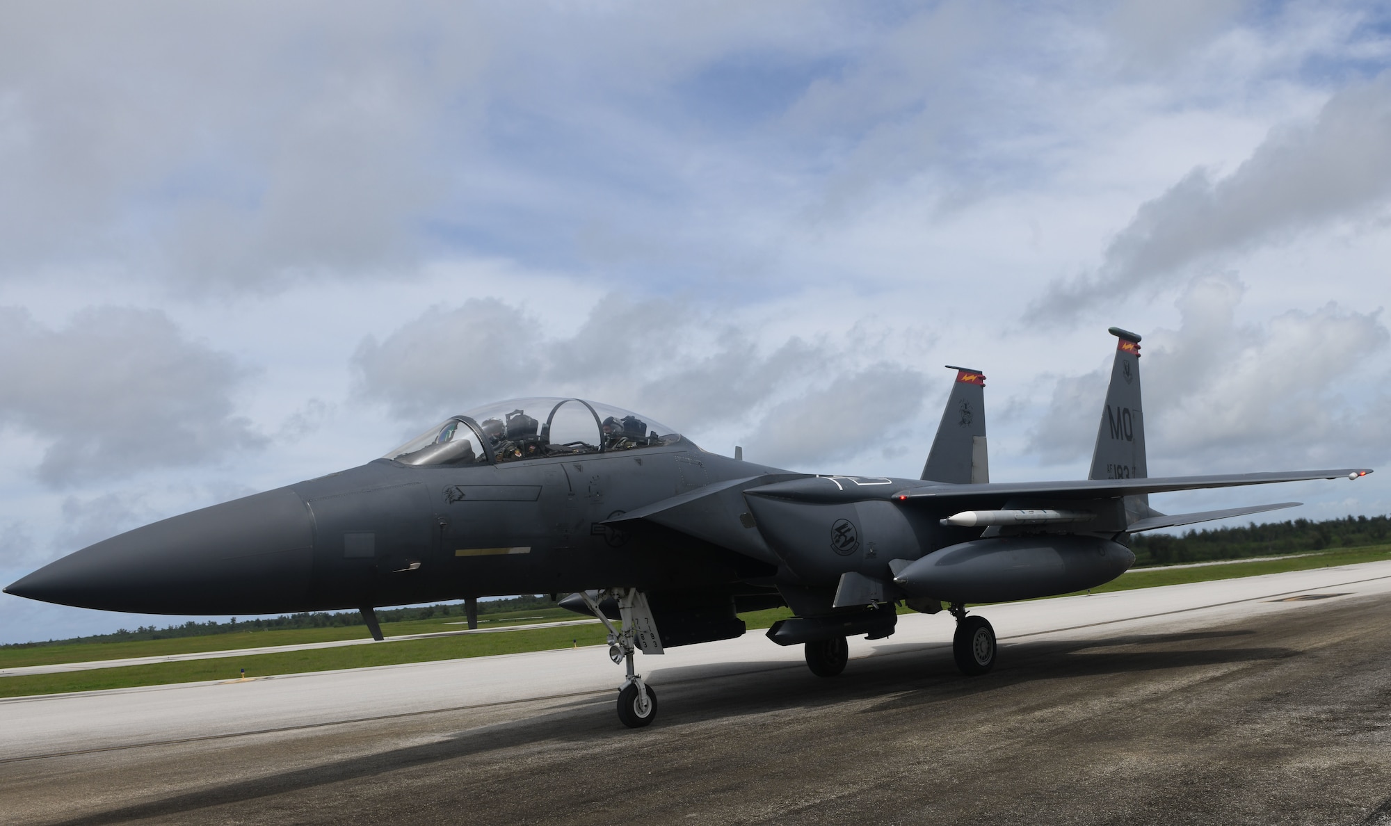 A U.S. Air Force F-15E Strike Eagle from Mountain Home Air Force Base, Idaho, taxis along the flightline at the Tinian International Airport, Tinian, July 27, 2021. Members from the 366th Fighter Wing arrived on Tinian for a historic first-time in order to support Pacific Iron 2021. Approximately 800 Airmen and 35 aircraft are participating in Pacific Air Forces’ dynamic force employment operation July 11 to Aug. 8, 2021, in Guam and Tinian to project forces into U.S. Indo-Pacific Command’s area of responsibility in support of the 2018 National Defense Strategy, calling on the military to be a more lethal, adaptive and resilient force. (U.S. Air Force photo by Tech. Sgt. Benjamin Sutton)
