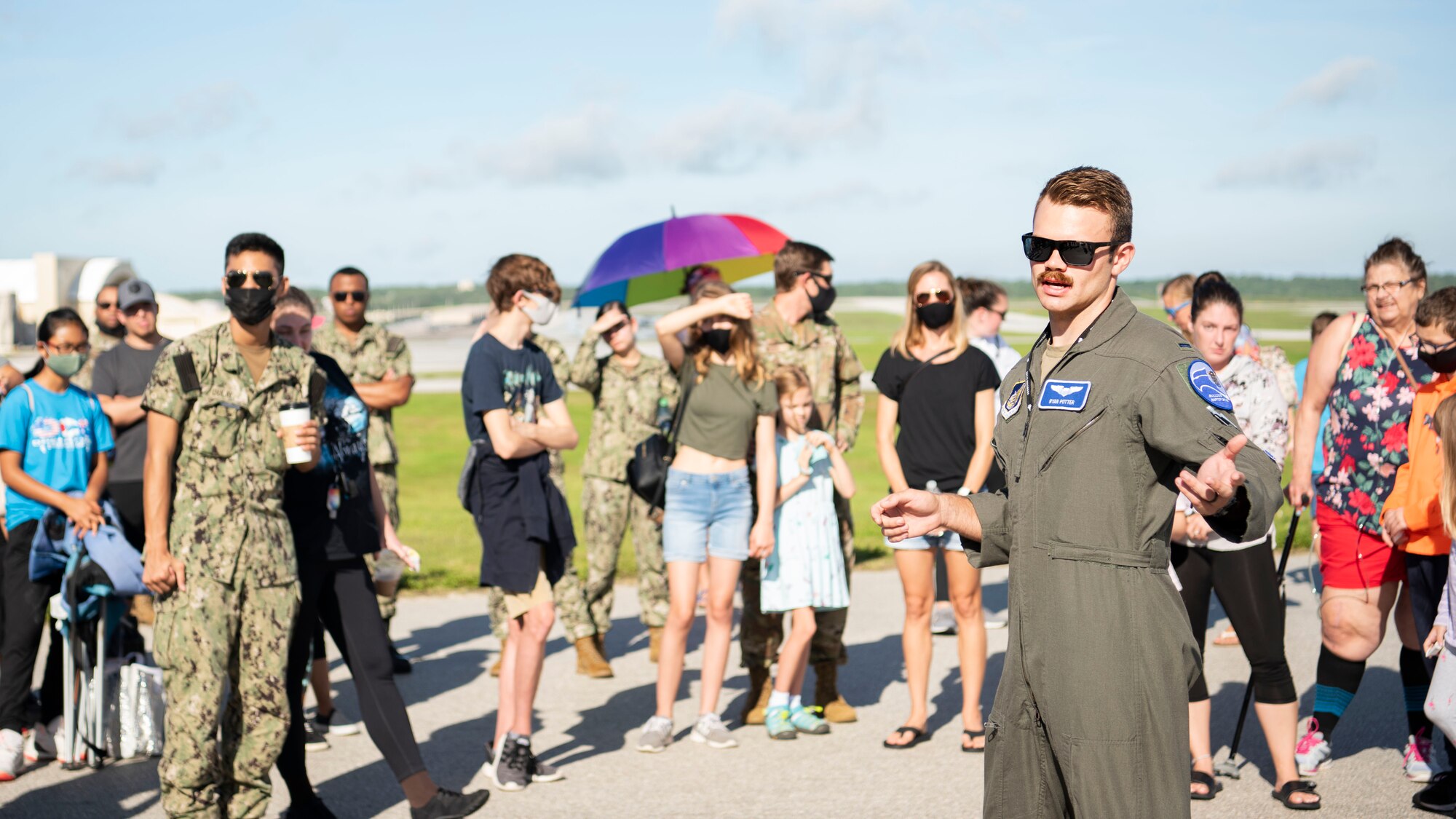 U.S. Air Force 1st Lt. Ryan Potter, a pilot with the 525th Fighter Squadron, assigned to Joint Base Elmendorf-Richardson, Alaska, speaks to members attending a flight line engagement for Pacific Iron 2021 at Andersen Air Force Base, Guam, Aug. 4, 2021. PACIRON focuses on deploying, operating, and sustaining forces from smaller, dispersed bases in the Indo-Pacific region. (U.S. Air Force photo by Senior Airman Aubree Owens)