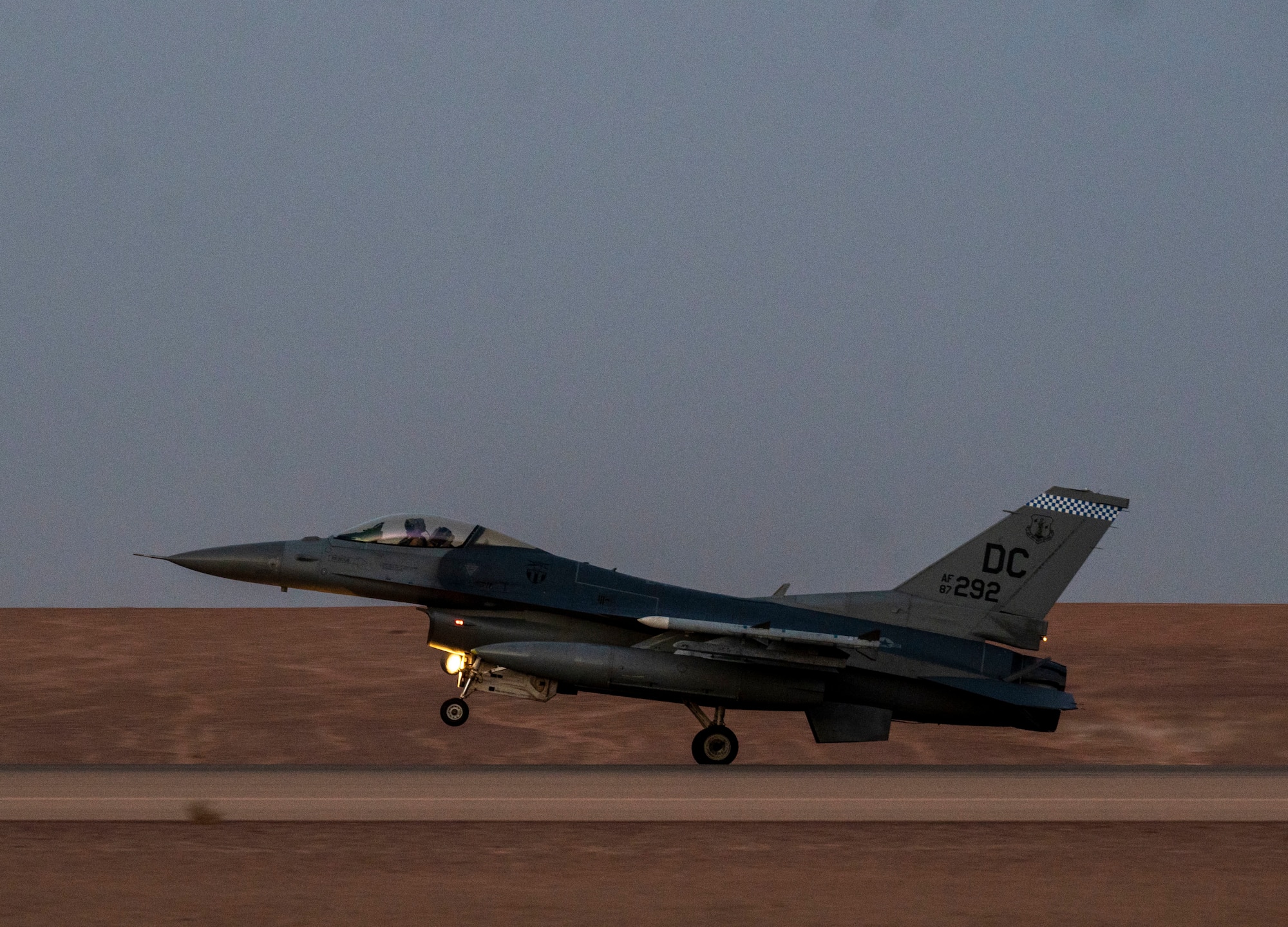 A U.S. Air Force F-16 Fighting Falcon lands on the runway at Prince Sultan Air Base, Kingdom of Saudi Arabia, after participating in a combined counter-unmanned aerial systems training operation with Royal Saudi aircraft, July 29, 2021. The event tested the ability of U.S. and Royal Saudi forces to collaboratively track and destroy a simulated invading UAS within regional airspace, continuing to demonstrate the shared focus on the security of regional airspace. (U.S. Air Force photo by Senior Airman Samuel Earick)
