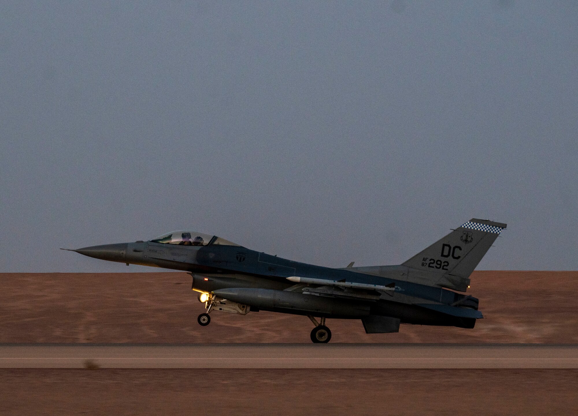 A U.S. Air Force F-16 Fighting Falcon lands on the runway at Prince Sultan Air Base, Kingdom of Saudi Arabia, after participating in a combined counter-unmanned aerial systems training operation with Royal Saudi aircraft, July 29, 2021. The event tested the ability of U.S. and Royal Saudi forces to collaboratively track and destroy a simulated invading UAS within regional airspace, continuing to demonstrate the shared focus on the security of regional airspace. (U.S. Air Force photo by Senior Airman Samuel Earick)