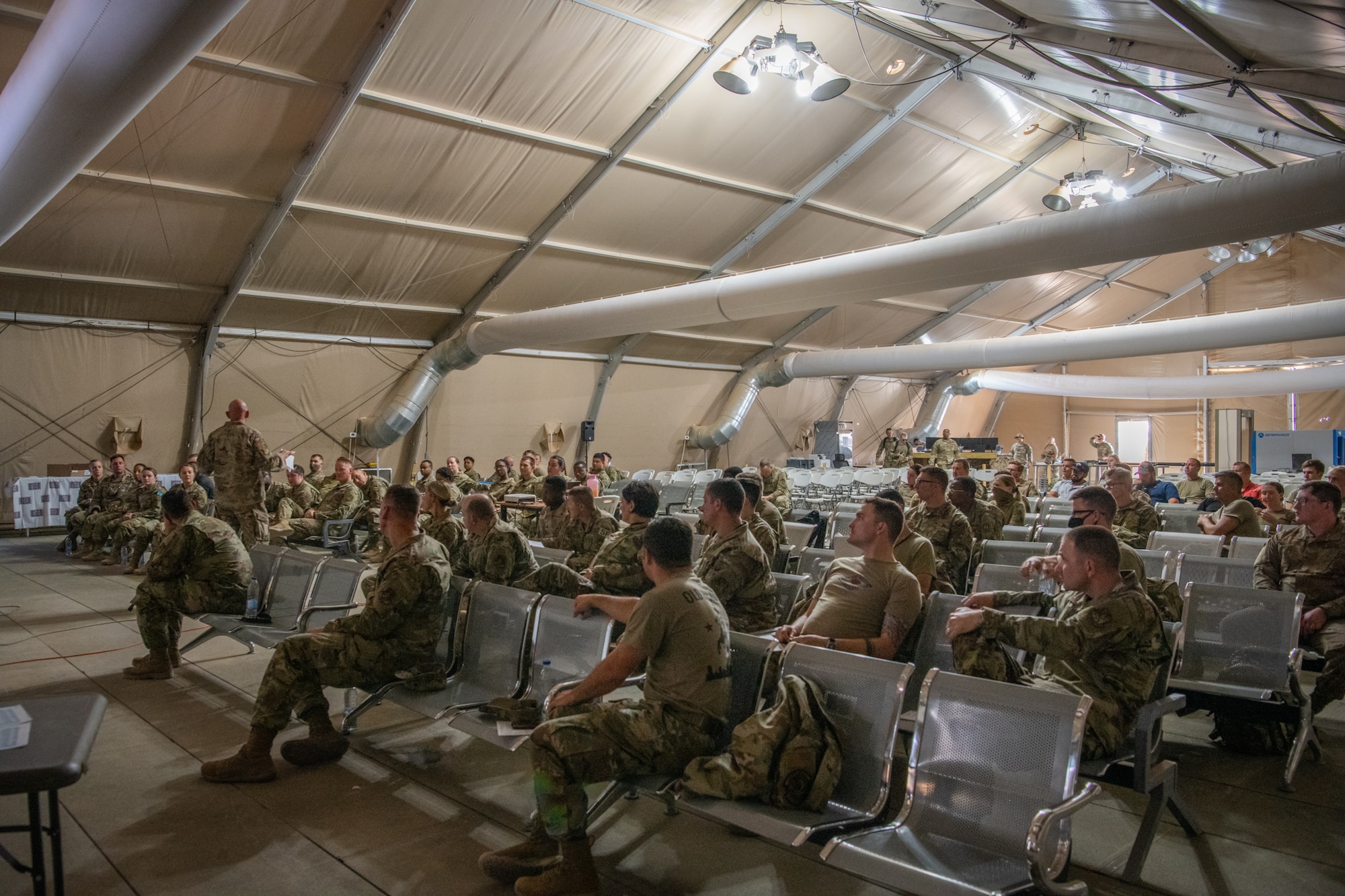 U.S. Air Force Col. Kevin Davidson, 378th Air Expeditionary Wing vice commander, addresses attendees of a Right Start briefing in the U.S. Passenger Terminal at Prince Sultan Air Base, Kingdom of Saudi Arabia, July 12, 2021.