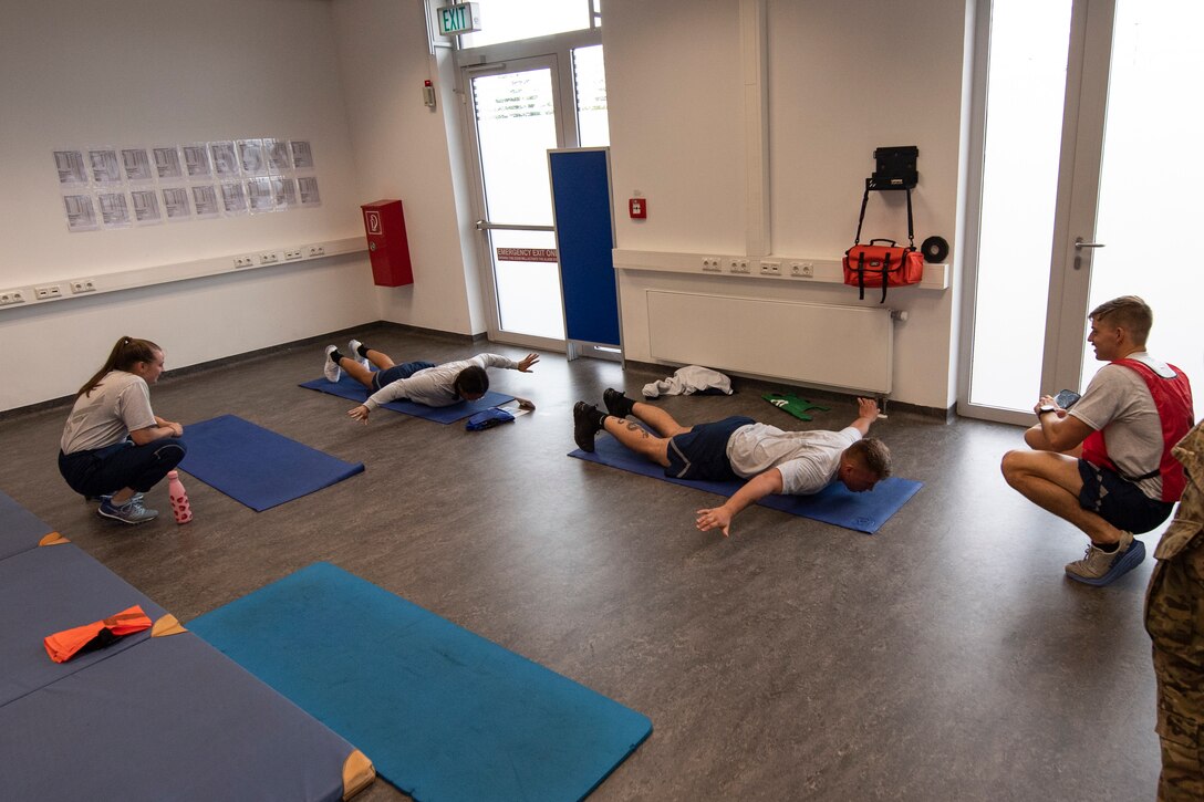 U.S. Air Force Airmen from the 52nd Aircraft Maintenance Squadron participate in a mock physical training test, Aug. 3, 2021, on Spangdahlem Air Base, Germany. The mock tests allowed Airmen to choose from the new fitness assessment alternatives to see which options were most suitable for each member. (U.S. Air Force photo by Staff Sgt. Melody W. Howley)