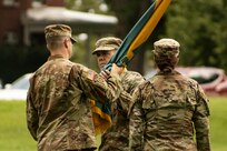 U.S. Army Reserve Col. Franklin J. Estes, incoming commander for the 151st Theater Information Operations Group, accepts the unit colors from U.S. Army Reserve Lt. Col. Jonathan P. Berliner, commander, 303rd Information Operations Army Service Component Command Support Detachment, during the change of command at Fort Totten, New York, July 18, 2021 (U.S. Army Reserve photo by Spc. Sean P. O'Hara, 151 Theater Information Operations Group).