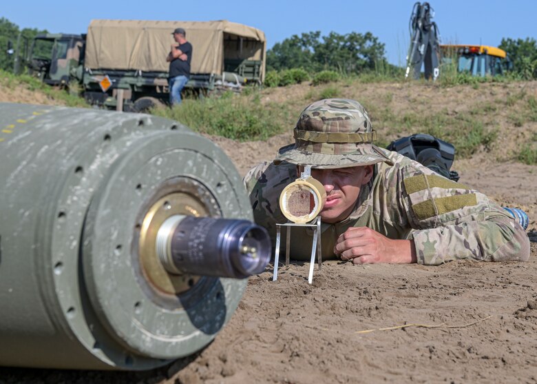 U.S. Air Force Senior Airman Kole Hiemenz, an explosive ordnance disposal technician assigned to the 148th Civil Engineer Squadron, Duluth, Minnesota, prepares to render a Mark 82 General Purpose 500 pound bomb safe July 25, 2021 during the Audacious Warrior Training Exercise at Fort McCoy, Wisconsin. Audacious Warrior 2021 consisted of 18 different EOD units across the Air National Guard and Air Force Reserve. (U.S. Air National Guard photo by Staff Sgt. Cameron Lewis)