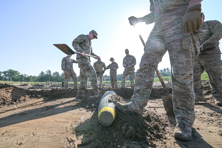U.S. Air Force Explosive Ordnance Disposal technicians prepare to render a Mark 82 500 pound general purpose bomb safe July 25, 2021 during the Audacious Warrior Training Exercise at Fort McCoy, Wisconsin. Audacious Warrior 2021 consisted of 18 different EOD units across the Air National Guard and U.S. Air Force Reserve. (U.S. Air National Guard photo by Staff Sgt. Cameron Lewis)