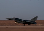 A U.S. Air Force F-16 Fighting Falcon lands on the runway at Prince Sultan Air Base, Kingdom of Saudi Arabia, after participating in a combined counter-unmanned aerial systems training operation with Royal Saudi aircraft, July 29, 2021. The event tested the ability of U.S. and Royal Saudi forces to collaboratively track and destroy a simulated invading UAS within regional airspace, continuing to demonstrate the shared focus on the security of regional airspace. (U.S. Air Force photo by Senior Airman Samuel Earick)