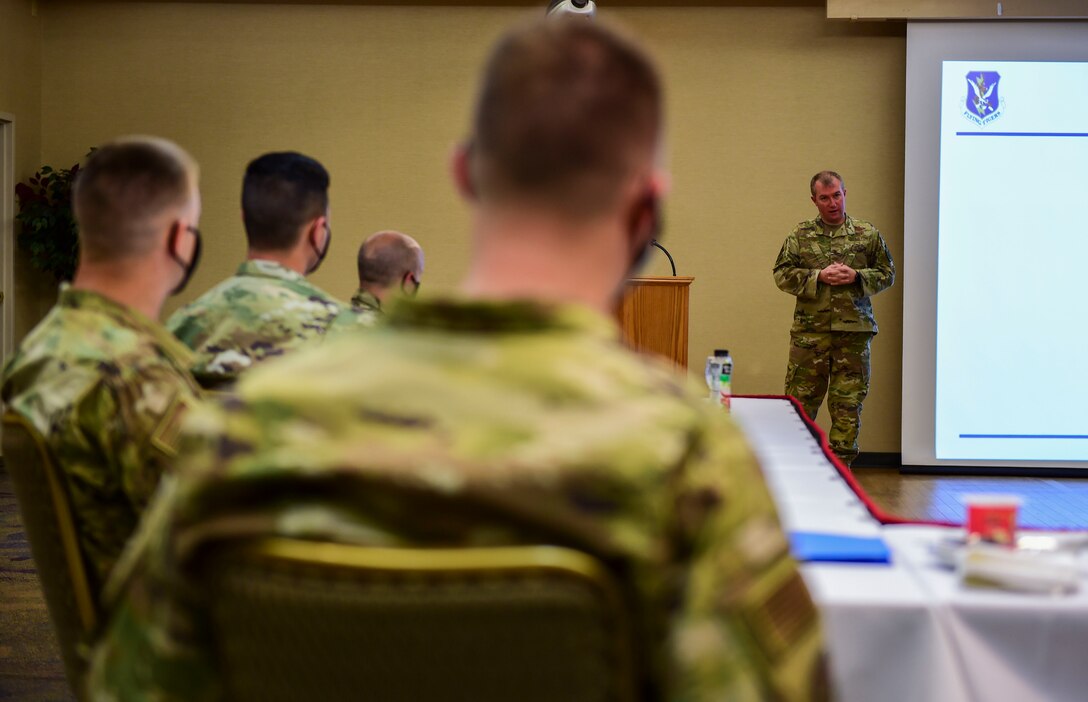 men sitting in a conference room