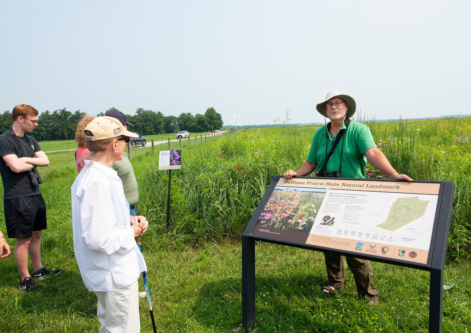 Dave Nolin, retired director of Five Rivers MetroParks, talks about wildflowers and prairies with participants July 19 in a nature walk sponsored by the 88th Civil Engineer Group’s
Environmental Branch on Huffman Prairie at Wright-Patterson Air Force Base. The natural prairie, where the Wright Brothers learned how to fly, is the largest in the state.