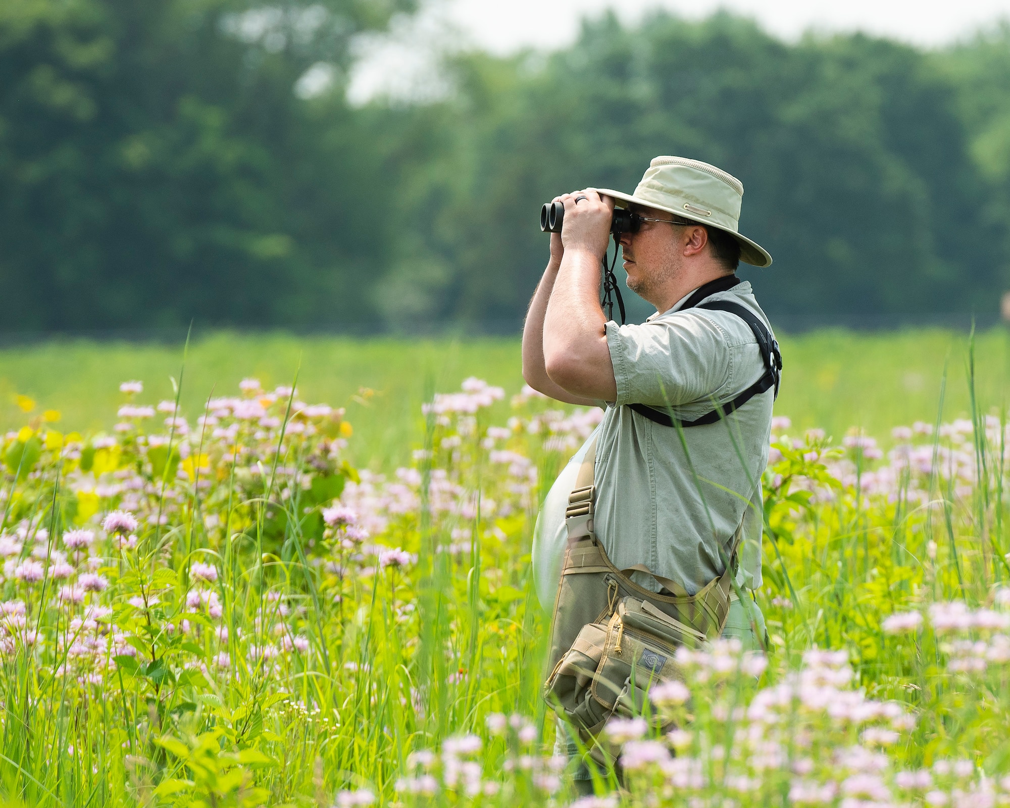 Ed Wolski looks for hummingbirds and other wildlife July
19 on Huffman Prairie at Wright-Patterson Air Force Base.
Wolski works as a civilian at the National Air and Space
Intelligence Center.