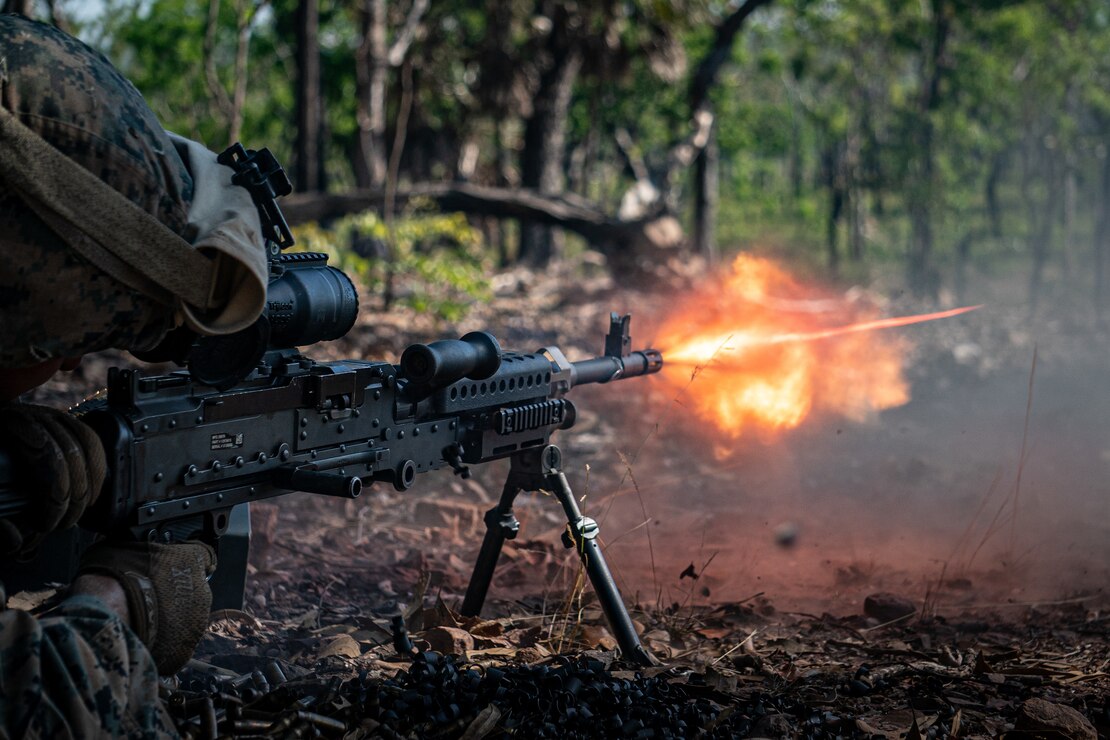 A U.S. Marine with Alpha Battery, 2nd Low Altitude Air Defense Platoon, Marine Medium Tiltrotor Squadron 363, Marine Rotational Force – Darwin, fires an M240B machine gun in the prone position at Kangaroo Flats Training Area, NT, Australia, July 8, 2021. The range consisted of training with an M240B machine gun mounted on a Humvee while bounding and firing from a static position with a bipod. The training hones the Marines’ capabilities as a skilled expeditionary fighting force that is capable of responding to a potential crisis or contingency.