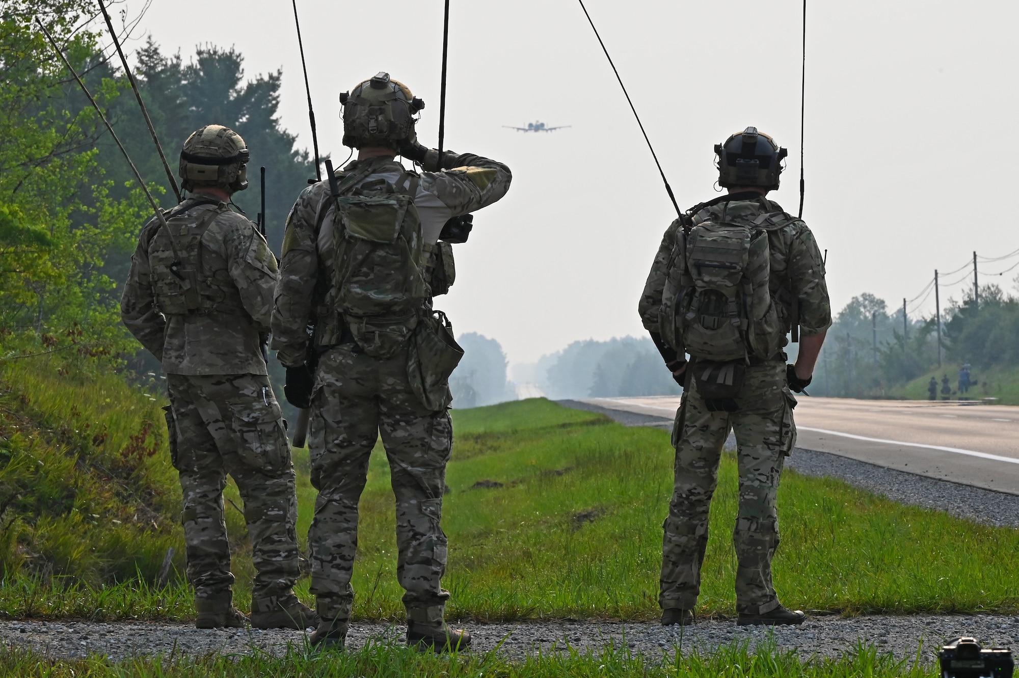 A U.S. Air Force 127th Wing A-10 Thunderbolt II, with ground air traffic control and guidance provided by Special Tactics operators from the 24th Special Operations Wing, lands on a closed public highway Aug. 5, 2021 at Alpena, Mich., for the first time ever as part of a training exercise during Northern Strike 21. The joint training event tested part of the agile employment concept, focusing on projecting combat power from austere locations. (U.S. Air Force photo by Staff Sgt. Ridge Shan)