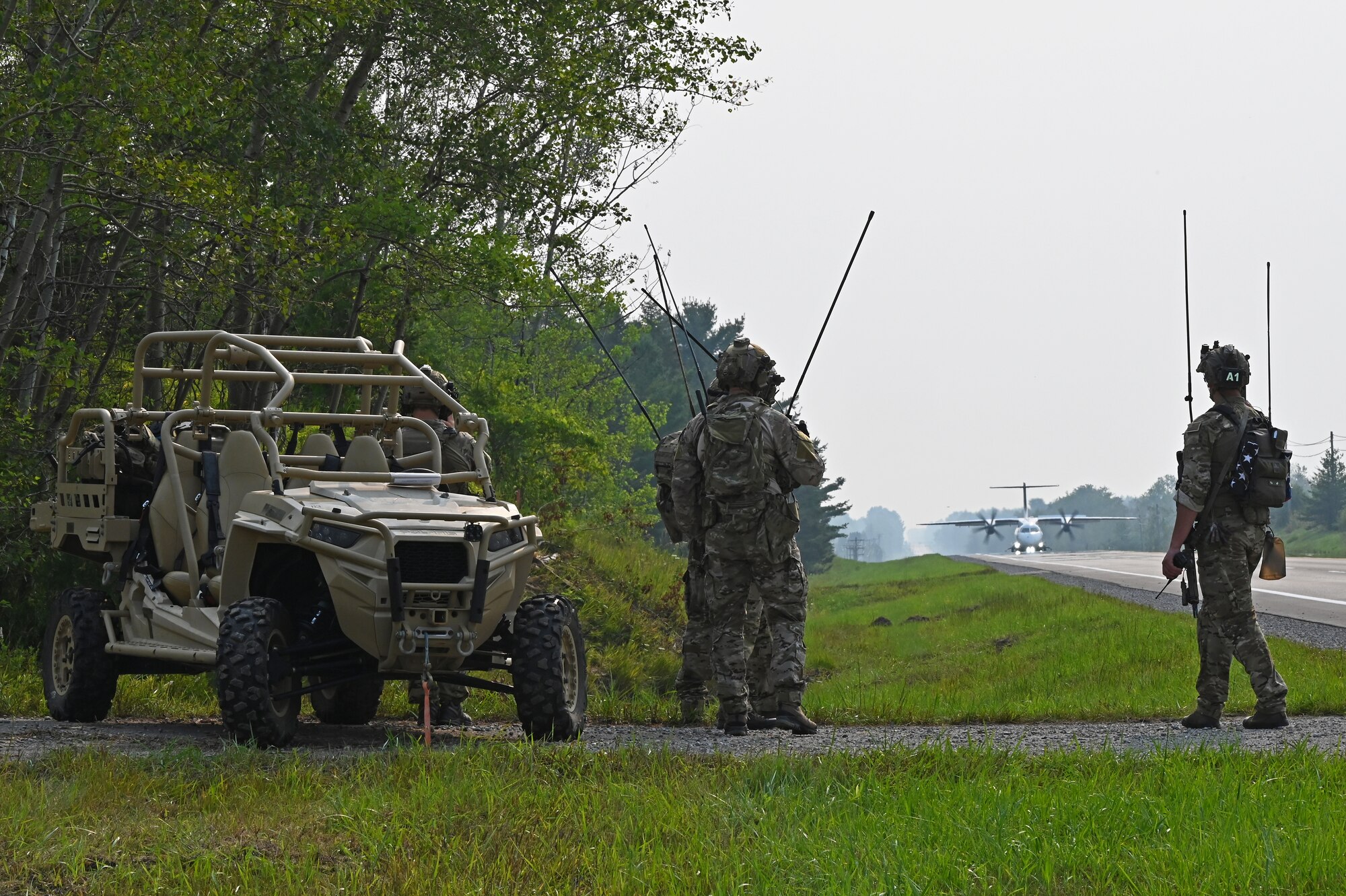 A U.S. Air Force 492nd Special Operations Wing C-146A Wolfhound, with ground air traffic control and guidance provided by Special Tactics operators from the 24th Special Operations Wing, lands on a closed public highway Aug. 5, 2021 at Alpena, Mich., for the first time ever as part of a training exercise during Northern Strike 21. The joint training event tested part of the agile employment concept, focusing on projecting combat power from austere locations. (U.S. Air Force photo by Staff Sgt. Ridge Shan)