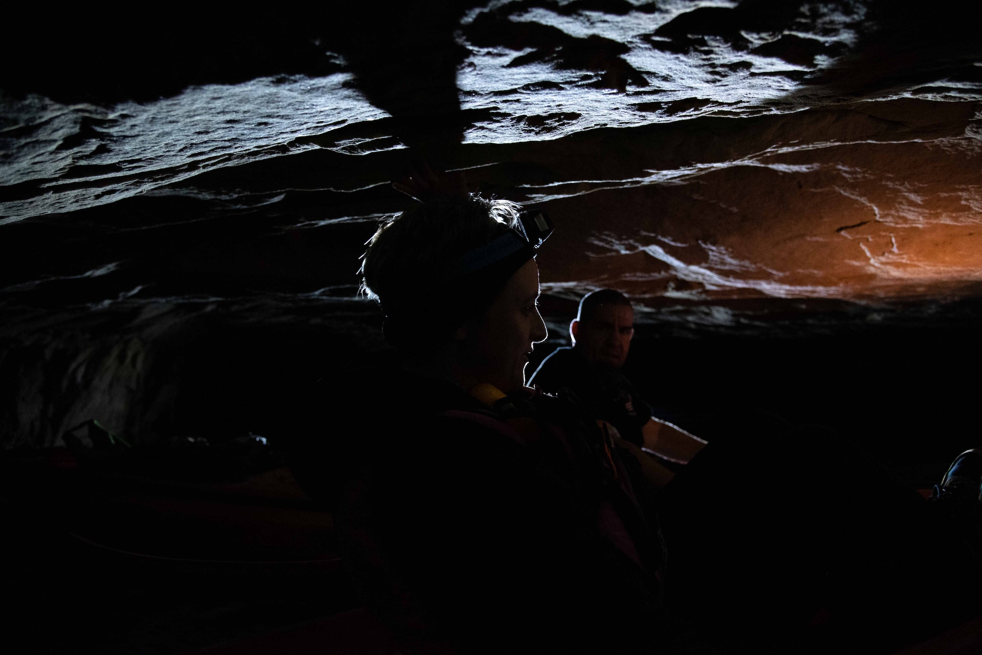 Woman in cave on kayak