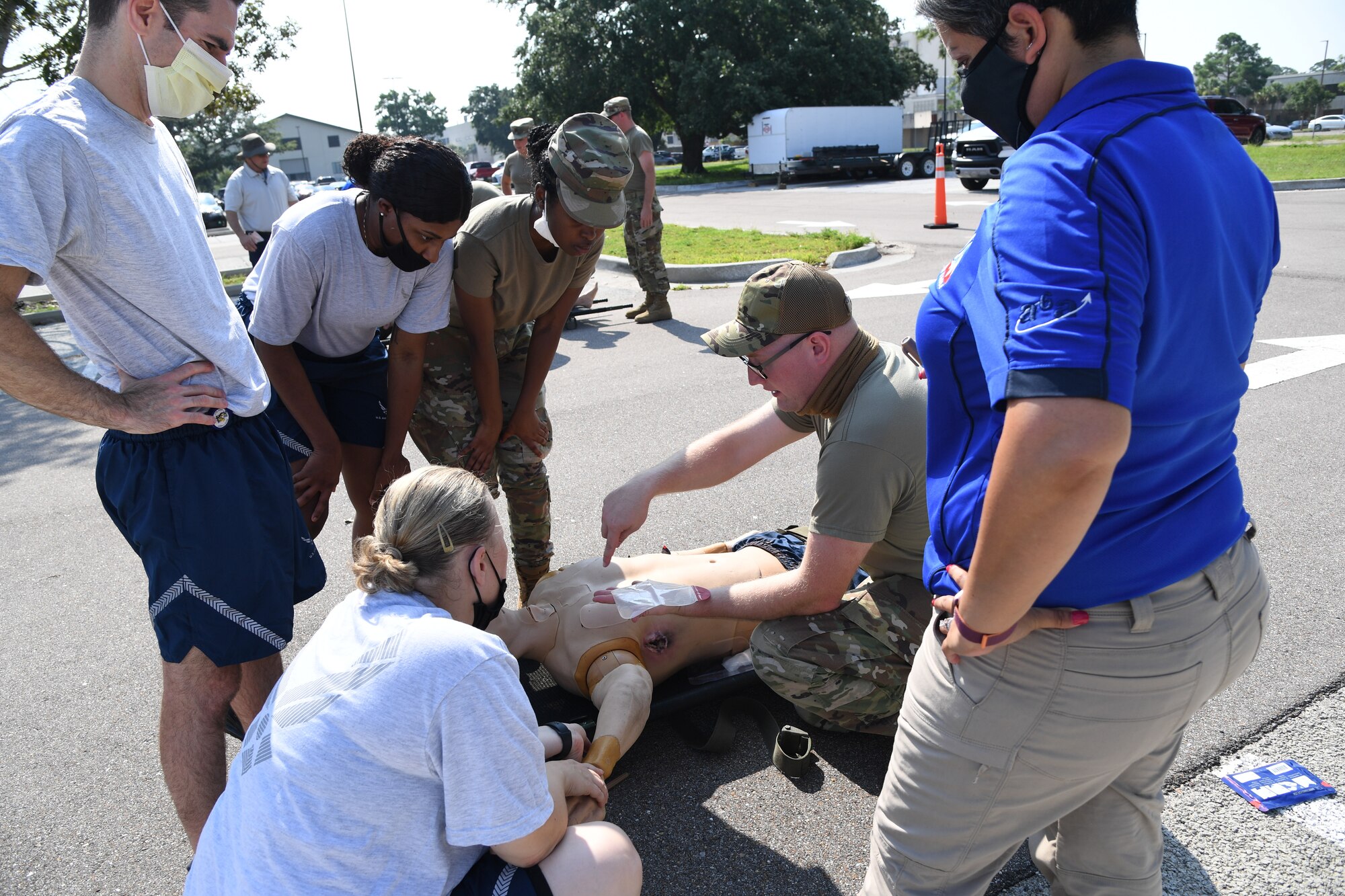 U.S. Air Force Staff Sgt. Timothy Parde, 81st Medical Support Squadron emergency medical services site coordinator, provides a triage procedure demonstration during a Tactical Combat Casualty Care Rodeo at Keesler Air Force Base, Mississippi, August 5, 2021. The rodeo, a Ready Eagle Training component, provides practical hands-on critical medical trauma skills training for 81st Medical Group personnel. (U.S. Air Force photo by Kemberly Groue)