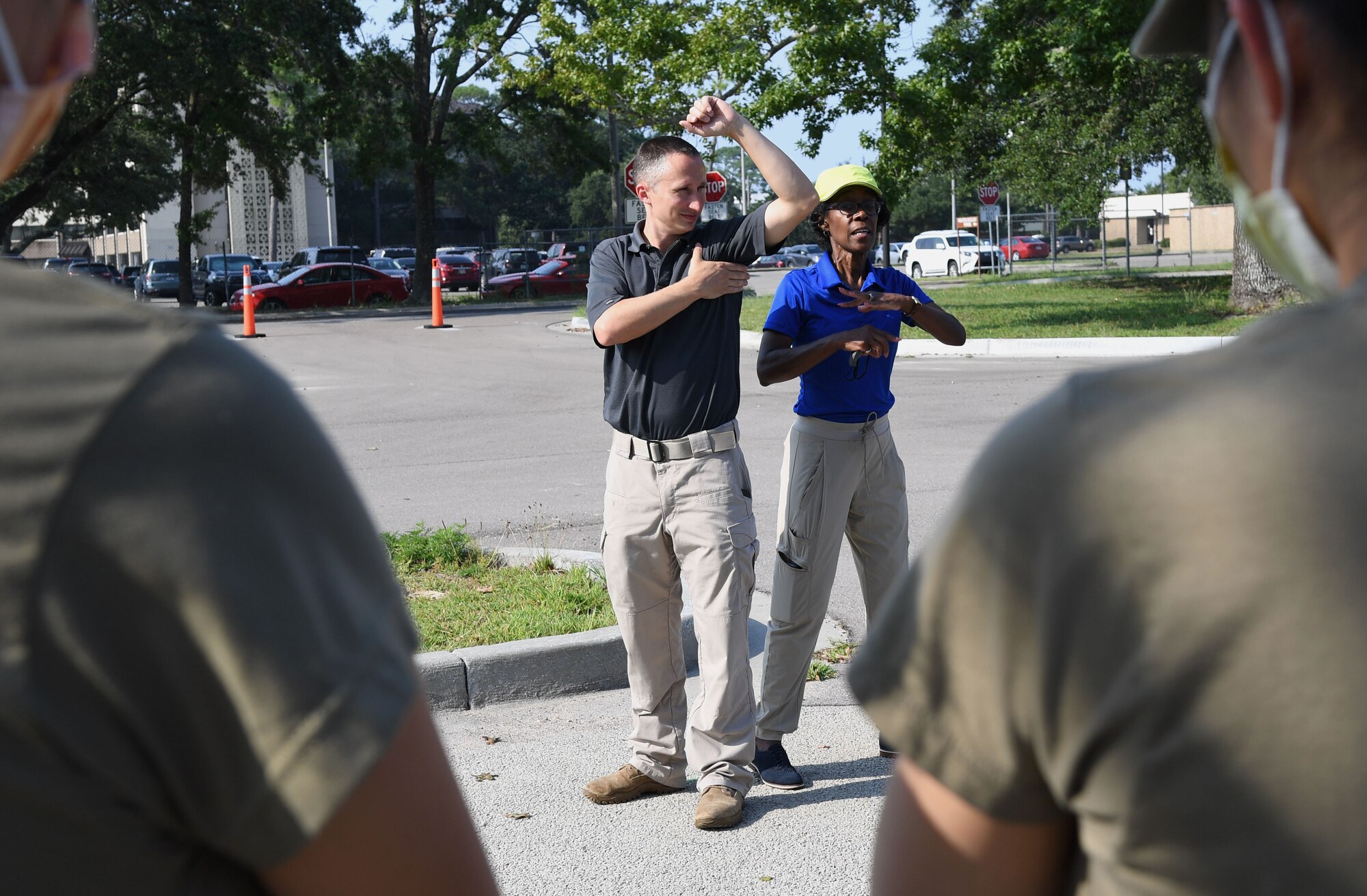 Matthew Shilling and Denise Hargrove, Booz Allen Hamilton medical readiness exercise facilitators, review triage procedures during a Tactical Combat Casualty Care Rodeo at Keesler Air Force Base, Mississippi, August 5, 2021. The rodeo, a Ready Eagle Training component, provides practical hands-on critical medical trauma skills training for 81st Medical Group personnel. (U.S. Air Force photo by Kemberly Groue)