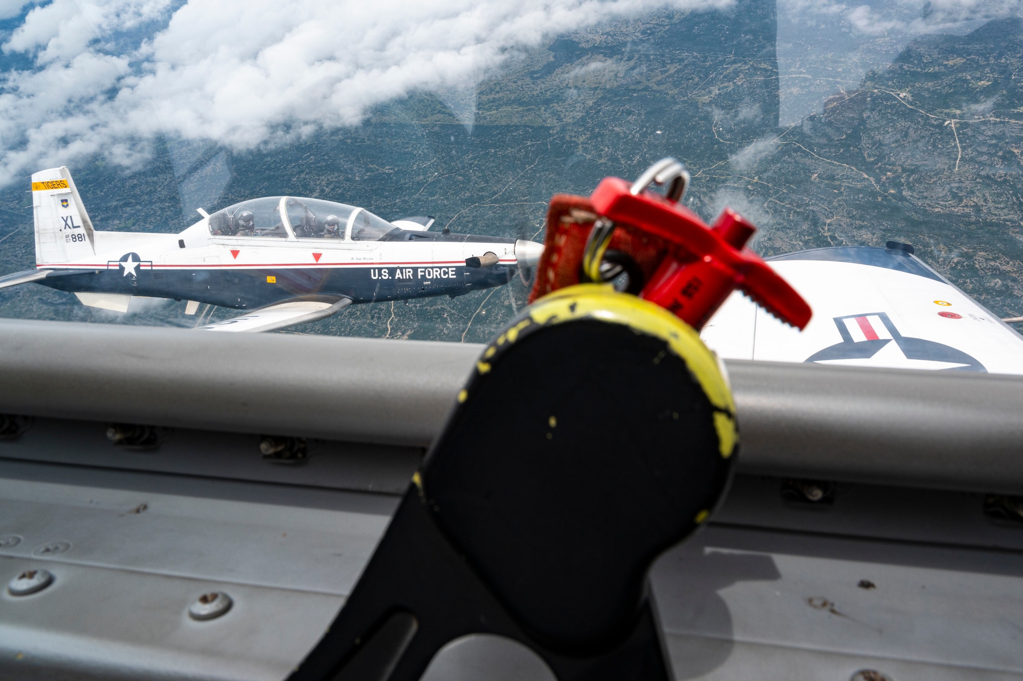 A Texan II T-6 fly’s though the air as it performs standard training routines to help shape pilots, at Laughlin Air Force Base, Texas, Jun. 4. 2021. The T-6 is the fir aircraft pilots get to fly during their yer long training. (U.S. Air Force photo by Airman 1st Class David Phaff)