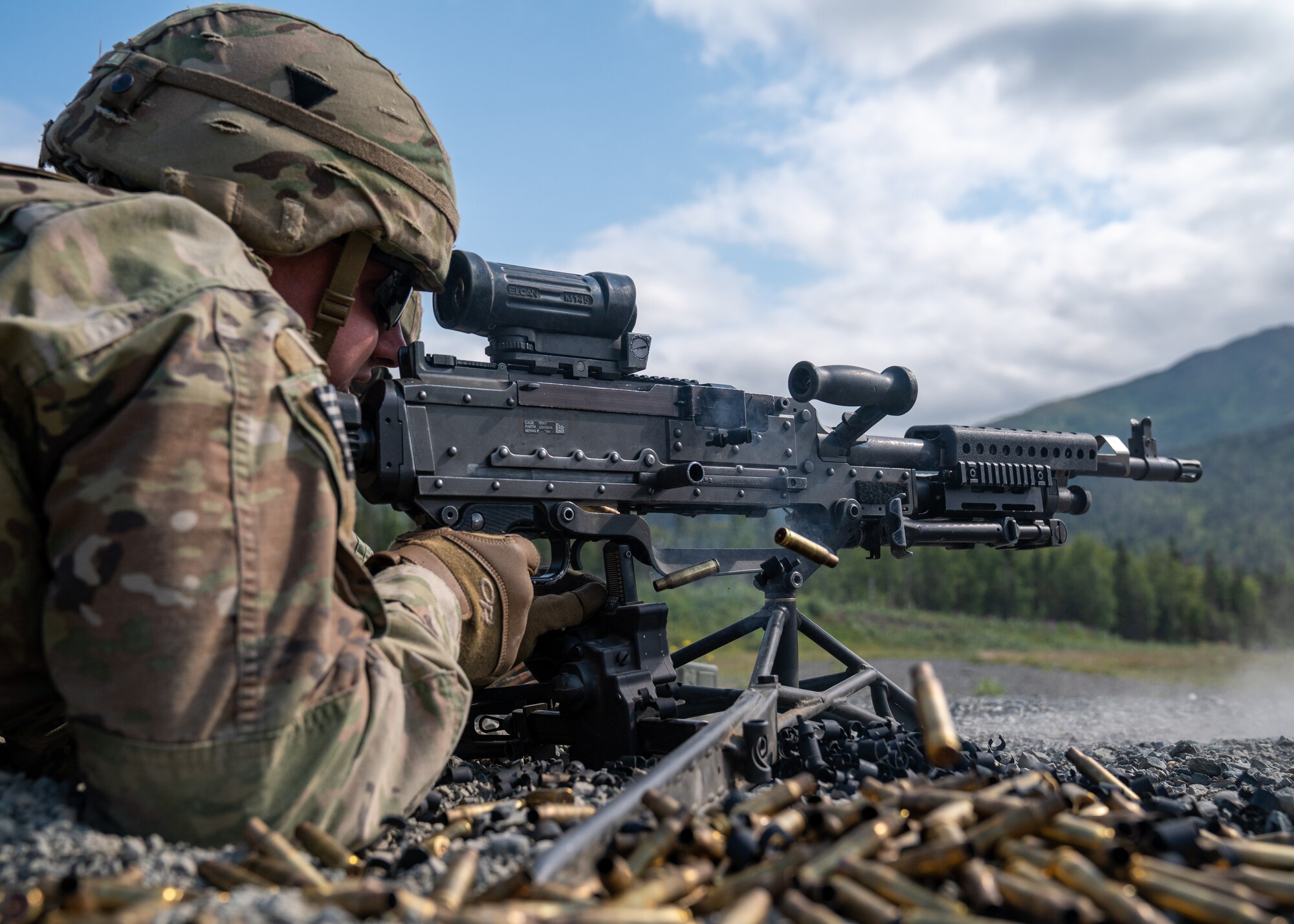 U.S. Army Spc. Paxton Butler, a combat engineer assigned to the 6th Brigade Engineer Battalion (Airborne), 4th Infantry Brigade Combat Team (Airborne), 25th Infantry Division, U.S. Army Alaska, fires an M240B machine gun while conducting live-fire training.