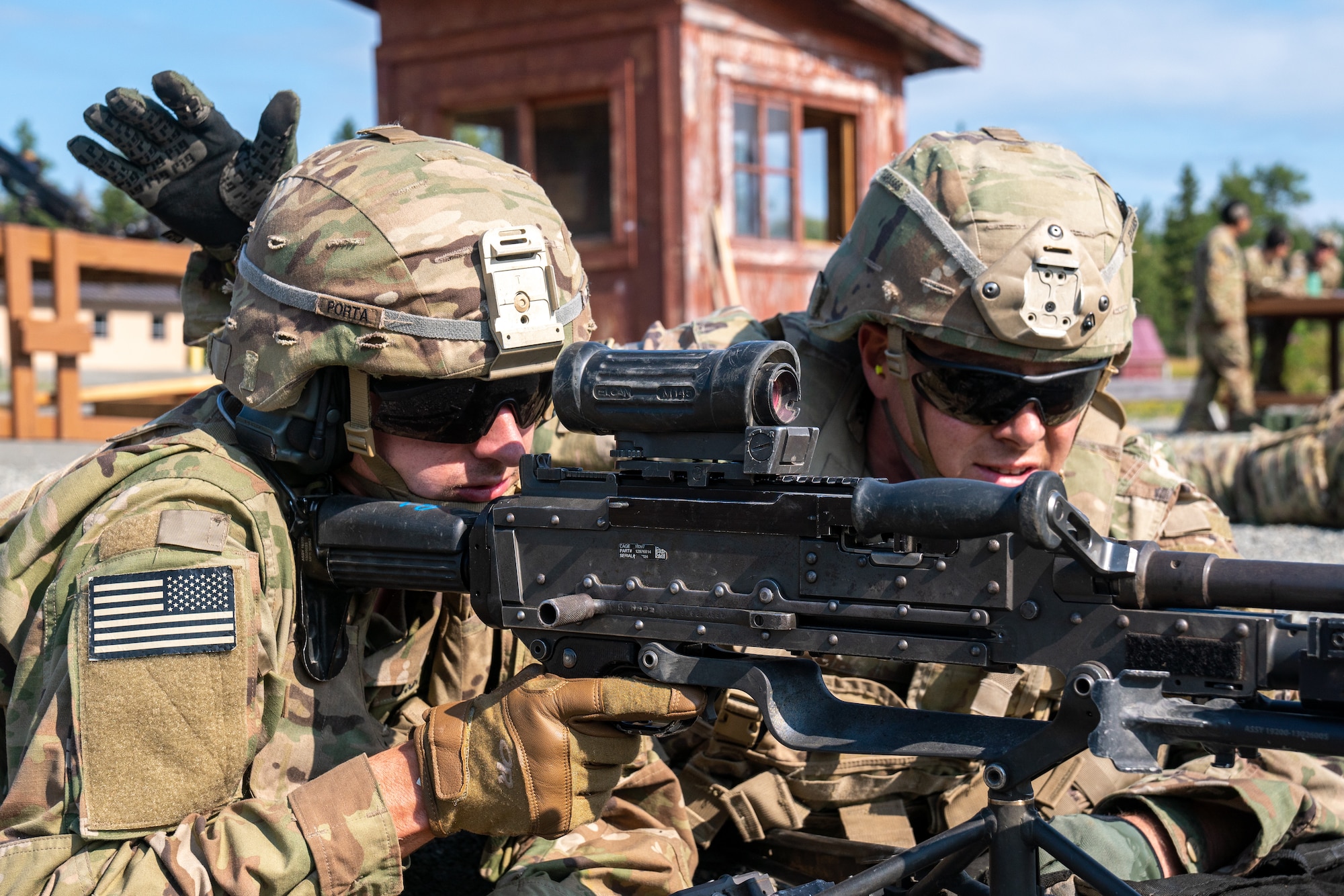 U.S. Army Pfc. Jeremy Porta (left) and Spc. Richard Evans, combat engineers assigned to the 6th Brigade Engineer Battalion (Airborne), 4th Infantry Brigade Combat Team (Airborne), 25th Infantry Division, U.S. Army Alaska, fire an M240B machine gun while conducting live-fire training.
